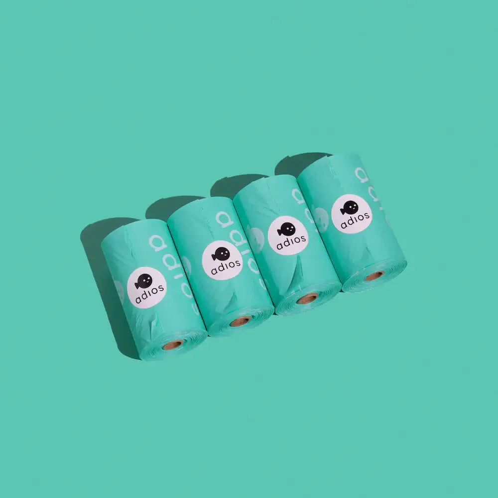 Image of four Mint coloured Adios poo bags, biodegradable poop bags for dogs 