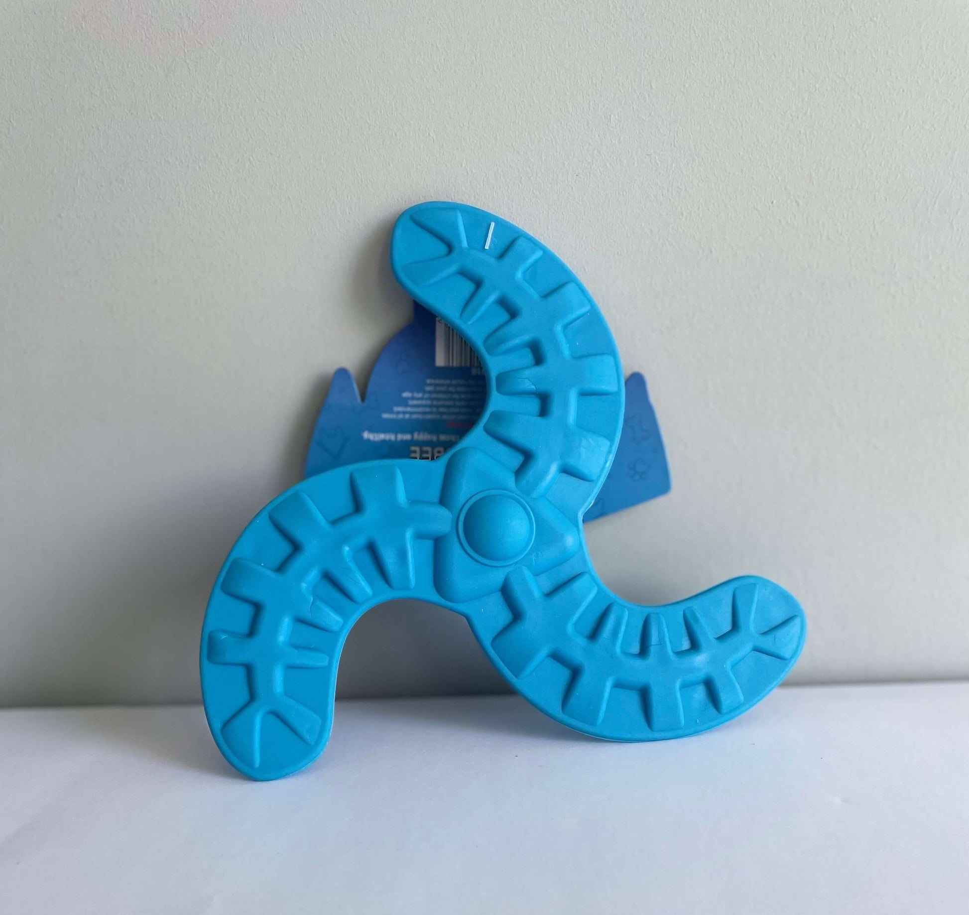 Image of a blue rubber frisbee dog toy