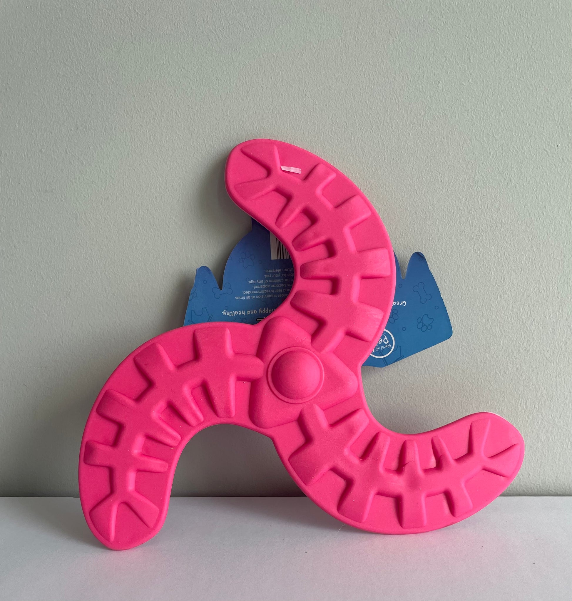 Image of a pink rubber frisbee dog toy